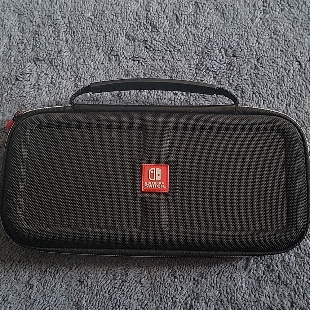 Nintendo Switch Game Traveler Deluxe Case, black, gently used.